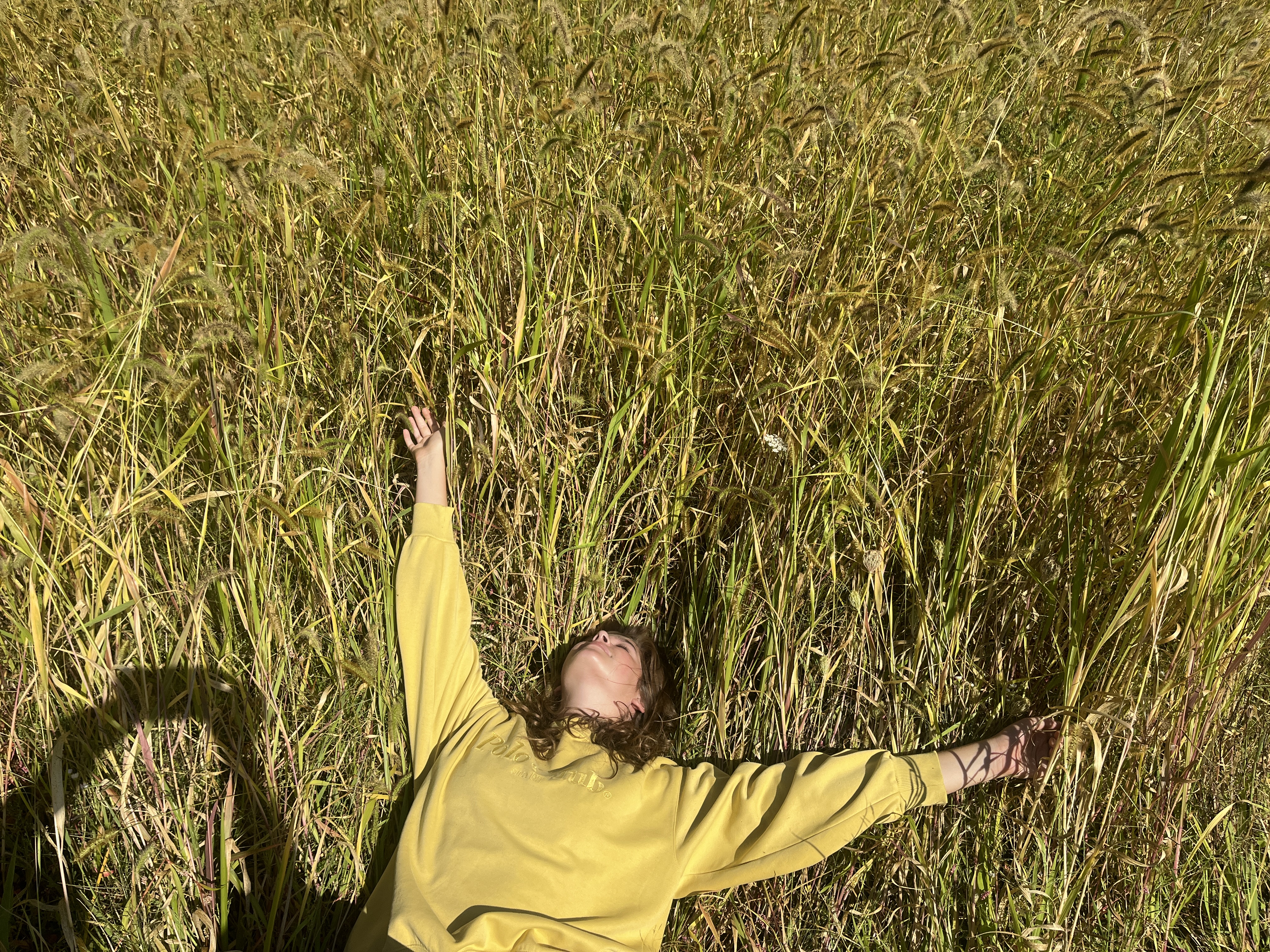 Me in a grassy field laying